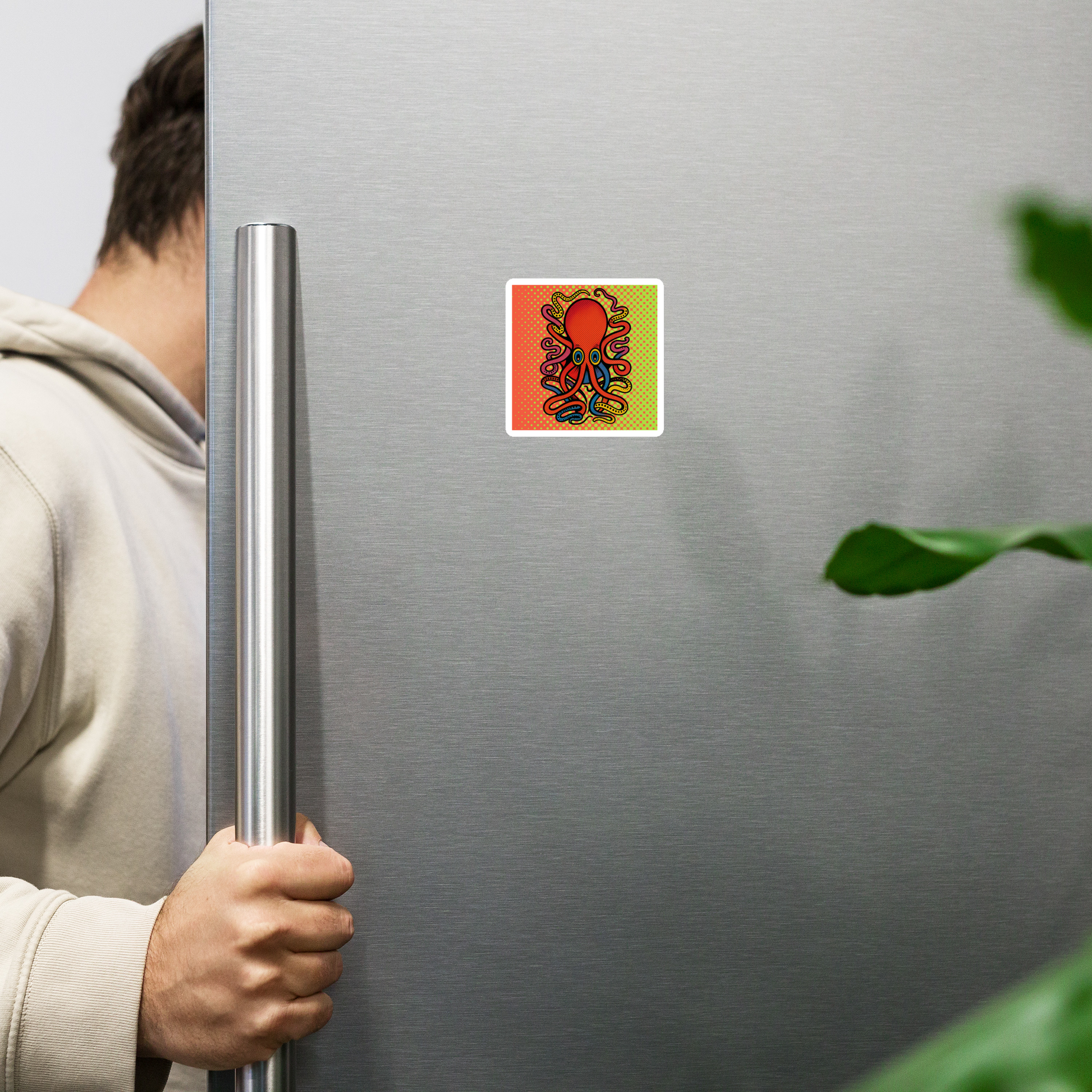 Person holding a silver refrigerator with 8 Armed Cuttlefish pop art magnet 3x3 — colorful cuttlefish on halftone background