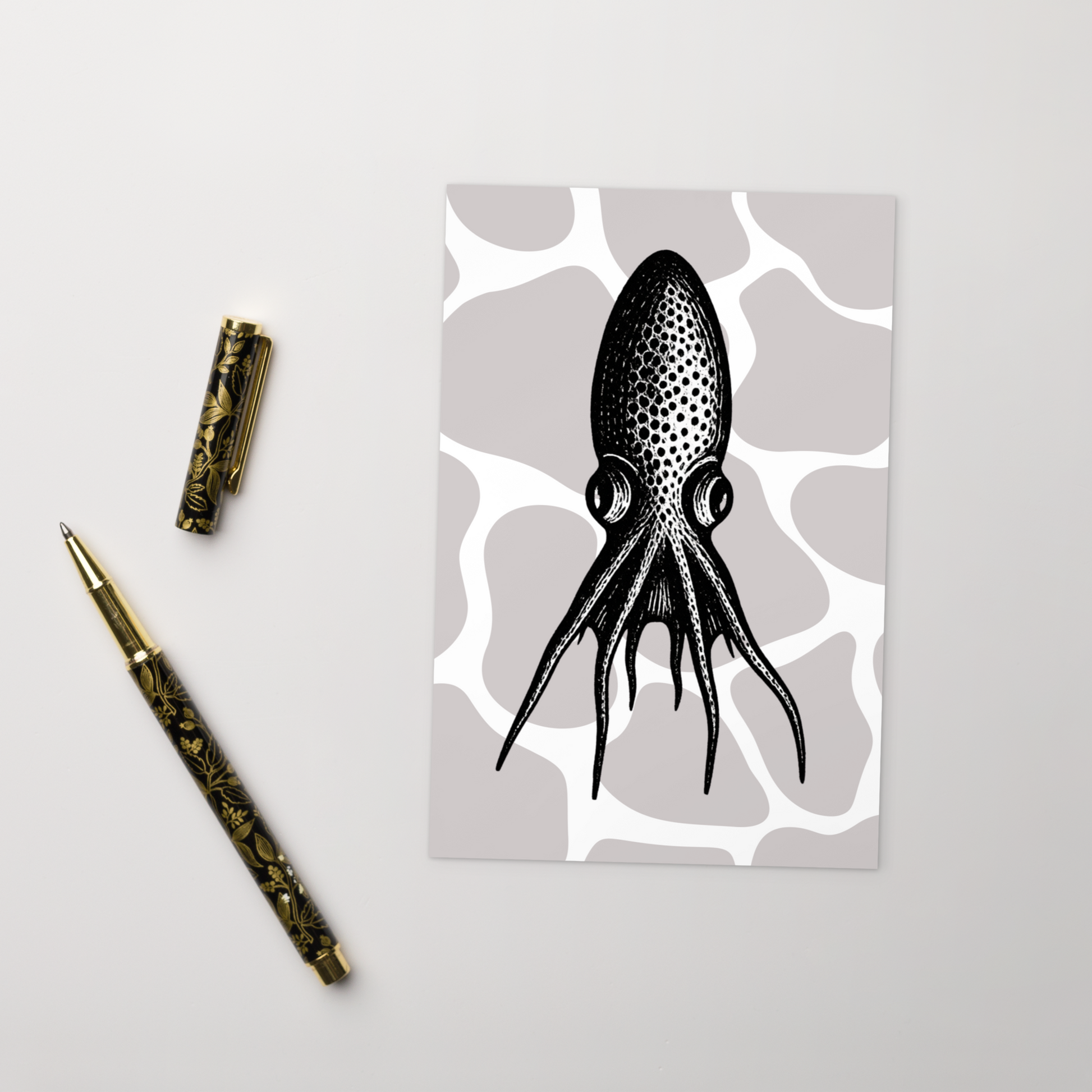 Blanket Octopus vintage illustration postcard — black and white illustration of Tremoctopus on a patterned background with a decorative pen next to it.